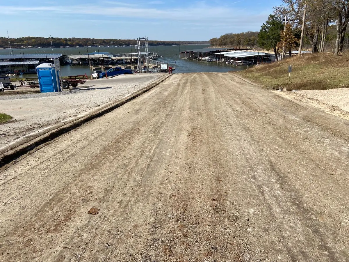 Stabilized boat ramp leading down to a lake marina